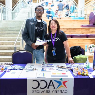 Two ACC career services representatives at a table.